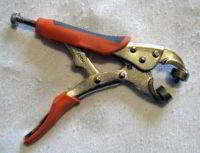 Standard grommet pliers, size 00 grommets 3/16 diameter hole.