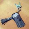 A Mini falconers Glove key chain