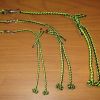 A COMPLETE FOUR STRAND ROUND BRAIDED TETHERING SYSTEM WITH SWIVEL
