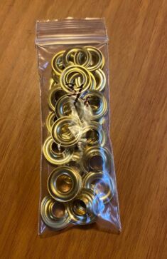 Grommets. Size 2" 3/8 diameter holes. 25 sets per pack