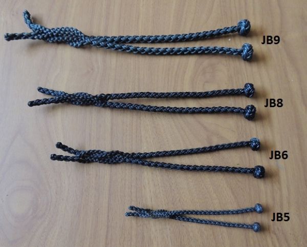 A - EIGHT STRAND ROUND BRAIDED JESSES IN FIVE SIZES , SOLID BLACK COLOR.