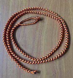 A - EIGHT STRAND ROUND BRAIDED LOOP LEASH – COMES IN THREE SIZES, COLOR IS BLACK AND ORANGE.