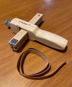 A solid wood Leather Strap Cutter