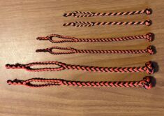 EIGHT STRAND ROUND BRAIDED JESSES IN THREE SIZES, COLOR IS BLACK AND ORANGE