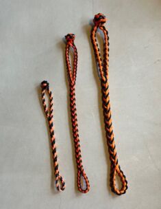 NEW EIGHT STRAND ROUND BRAIDED JESS EXTENDERS IN THREE SIZES, COLOR IS BLACK AND ORANGE.