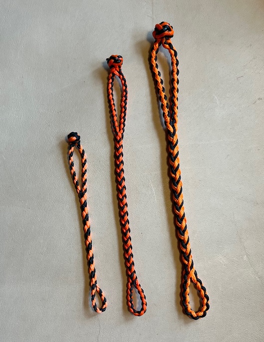 NEW EIGHT STRAND ROUND BRAIDED JESS EXTENDERS IN THREE SIZES, COLOR IS  BLACK AND ORANGE.
