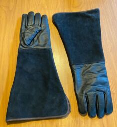 Medium weight Arm Length cowhide raptor and animal handling gloves. These gloves are on clearance sale