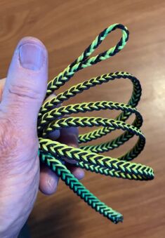 FLAT BRAIDED FOUR STRAND DACRON LEASHES BLACK AND FLORESCENT GREEN COMES IN FOUR SIZES AND STRENGTHS